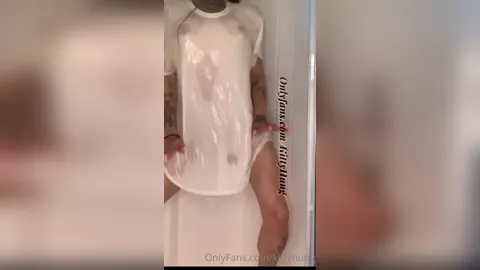 Kitty Hung teases with her huge dick in wet t-shirt